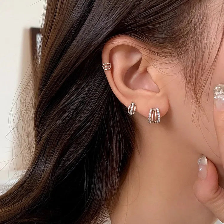 Geometric 925 silver stud earrings shown in three size options with silver needle posts