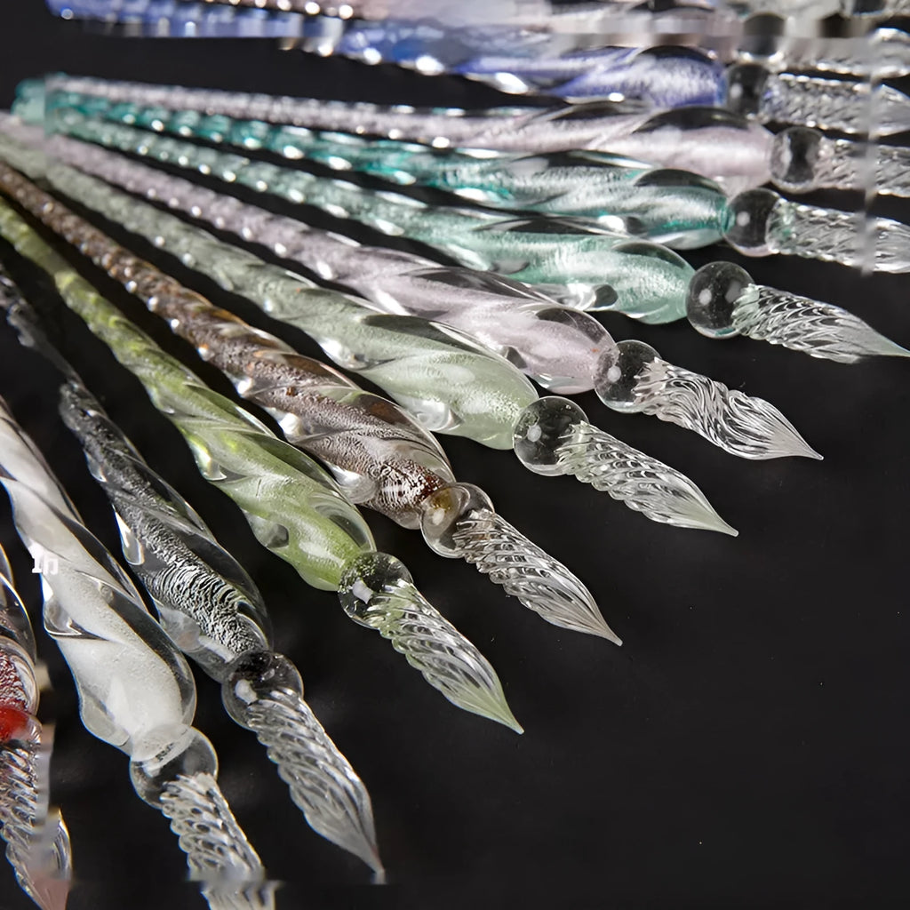Transparent glass crystal pen with coloured ink dipped in water art effect showing coloured glaze decorative technique