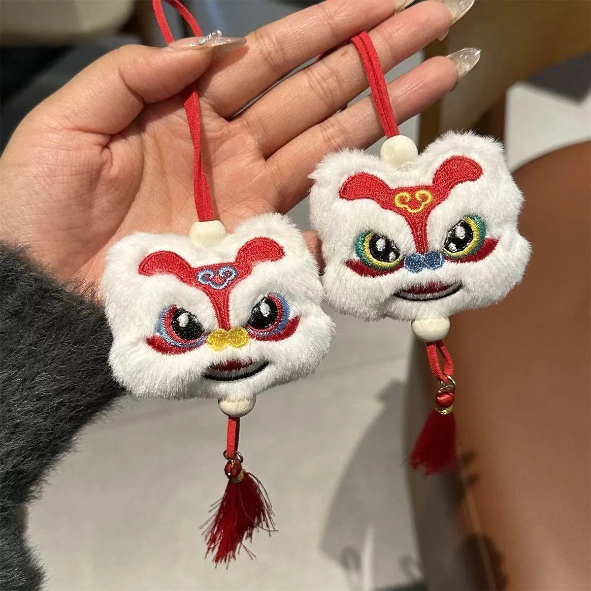 Blue Chinese style plush lion keychain ornament with star stone details and tassel