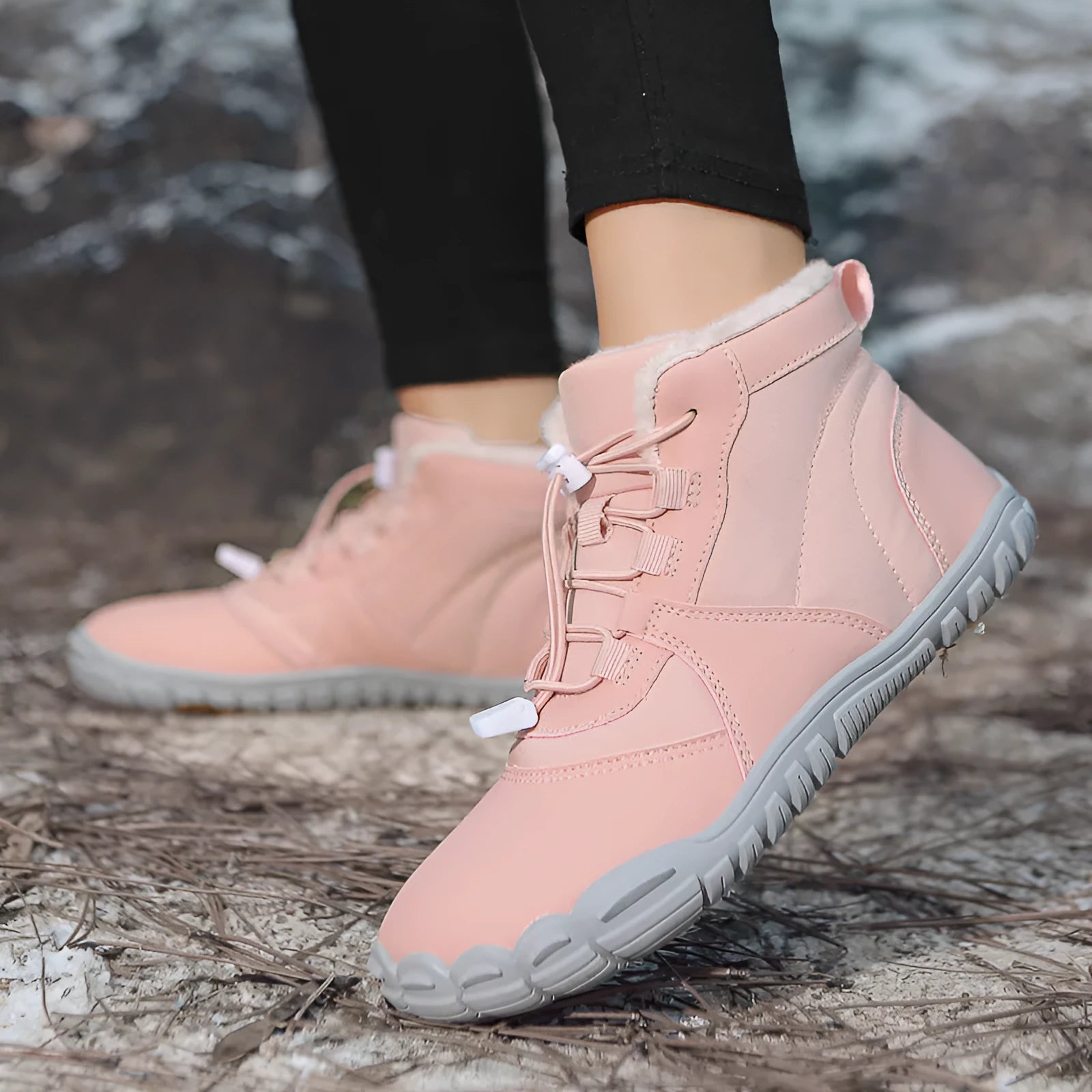 Unisex waterproof snow boots in black, khaki, or pink with round toe, lace-up front, and fleece lining.