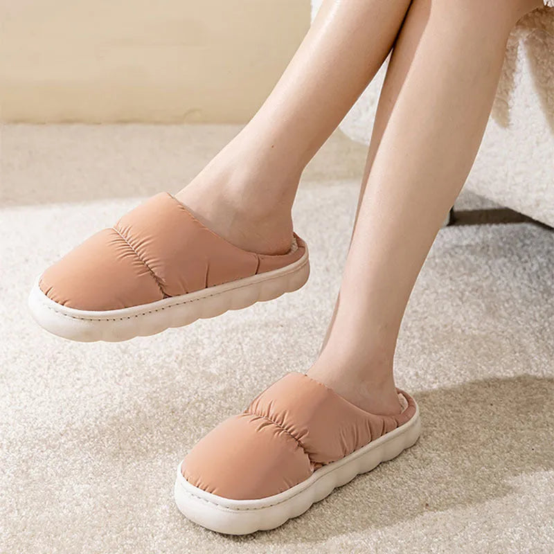 Pair of down cotton slippers with artificial leather upper and thick rubber sole, shown in available colours.