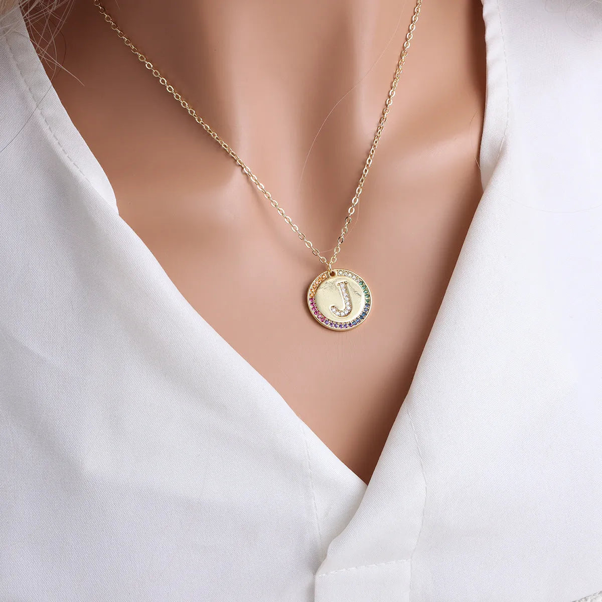 Gold English letter round pendant necklace with colourful crystals on clavicle length chain