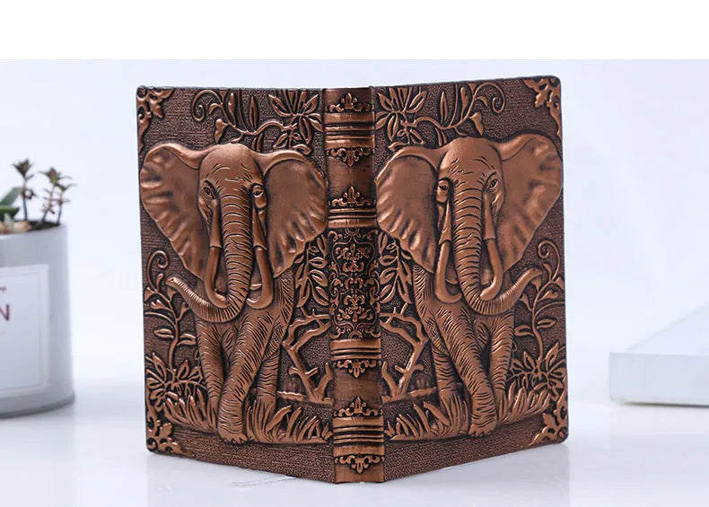 PU leather A5 notebook with three-dimensional embossed cover and bronze highlights, open to beige pages