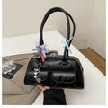 Brown retro pillow-shaped women's handbag with a flap closure and double shoulder straps.