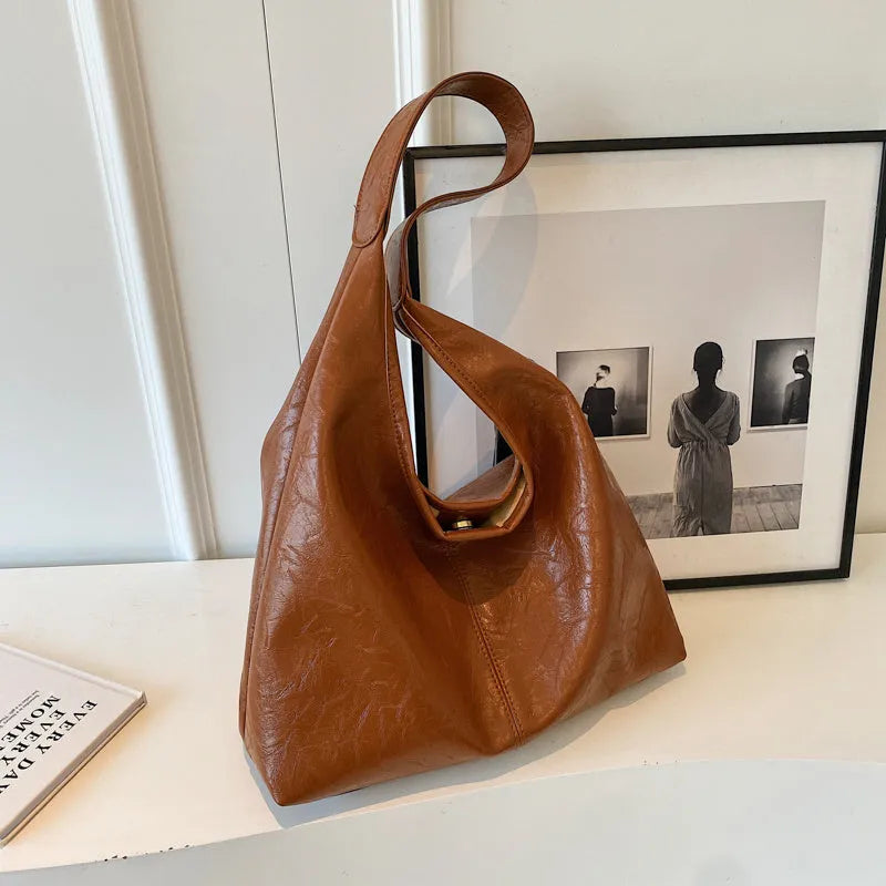 Soft PU leather shoulder bag with multiple external sandwich pockets in street-style design