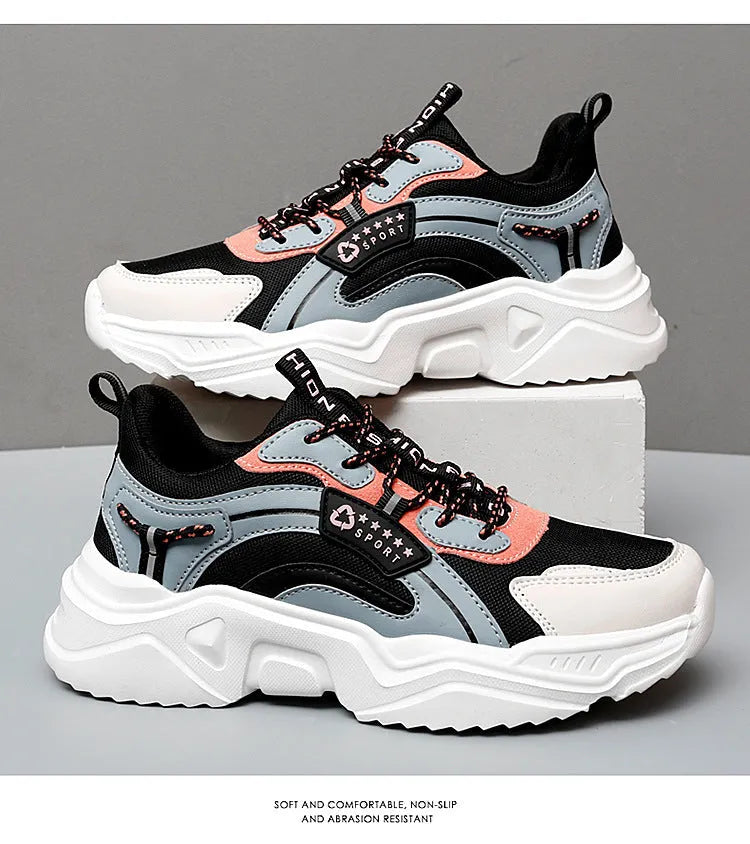 Women's white casual sports shoes with mesh upper, thick PU sole, and a buckle fastening.