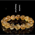 Natural yellow citrine Asestelle bracelet with geometric beads on a wrist.