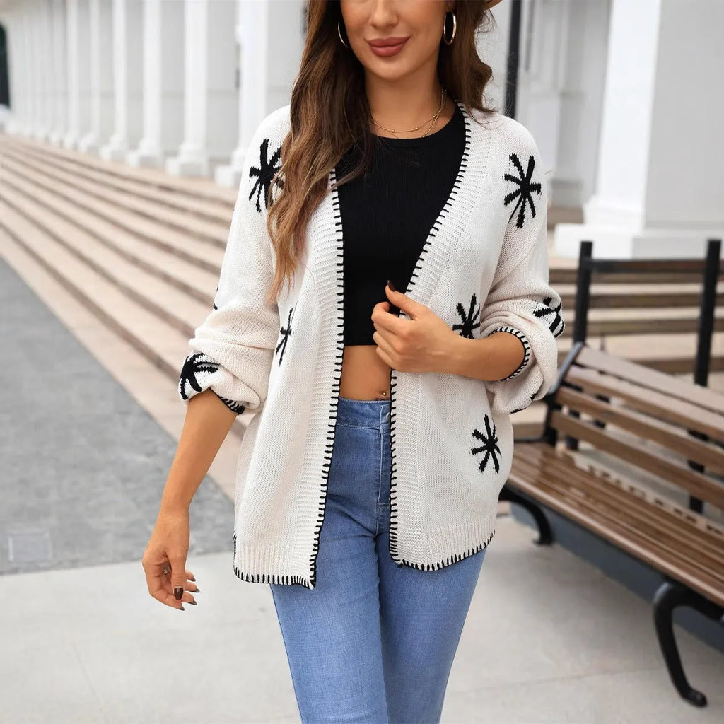 Beige plus-size women's cardigan with white Jacquard flower pattern, loose fit and off-neck design.