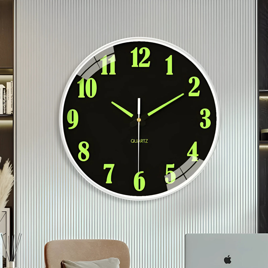 Modern 8 inch circular wall clock with luminous numerals on a white wall