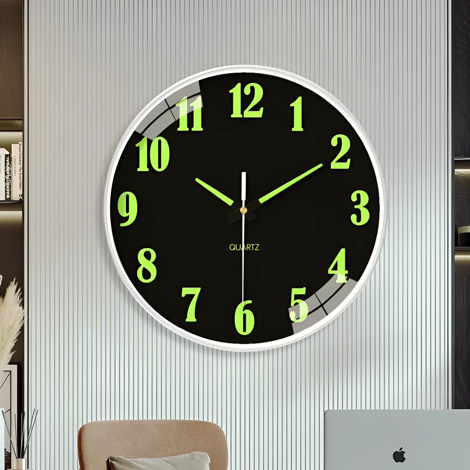 Modern 8 inch circular wall clock with luminous numerals on a white wall