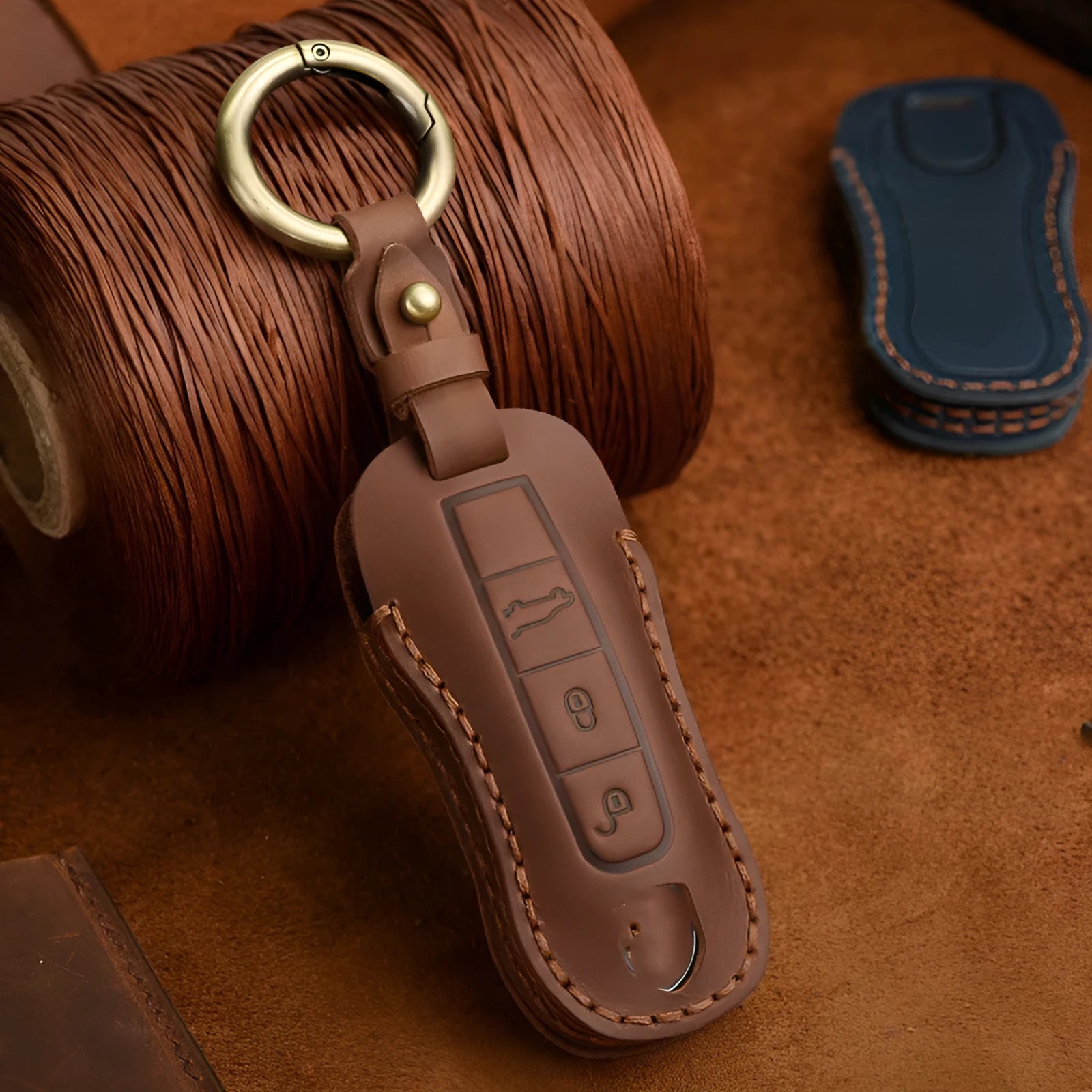 Porsche leather key case in retro style with bag buckle fastening in blue colour