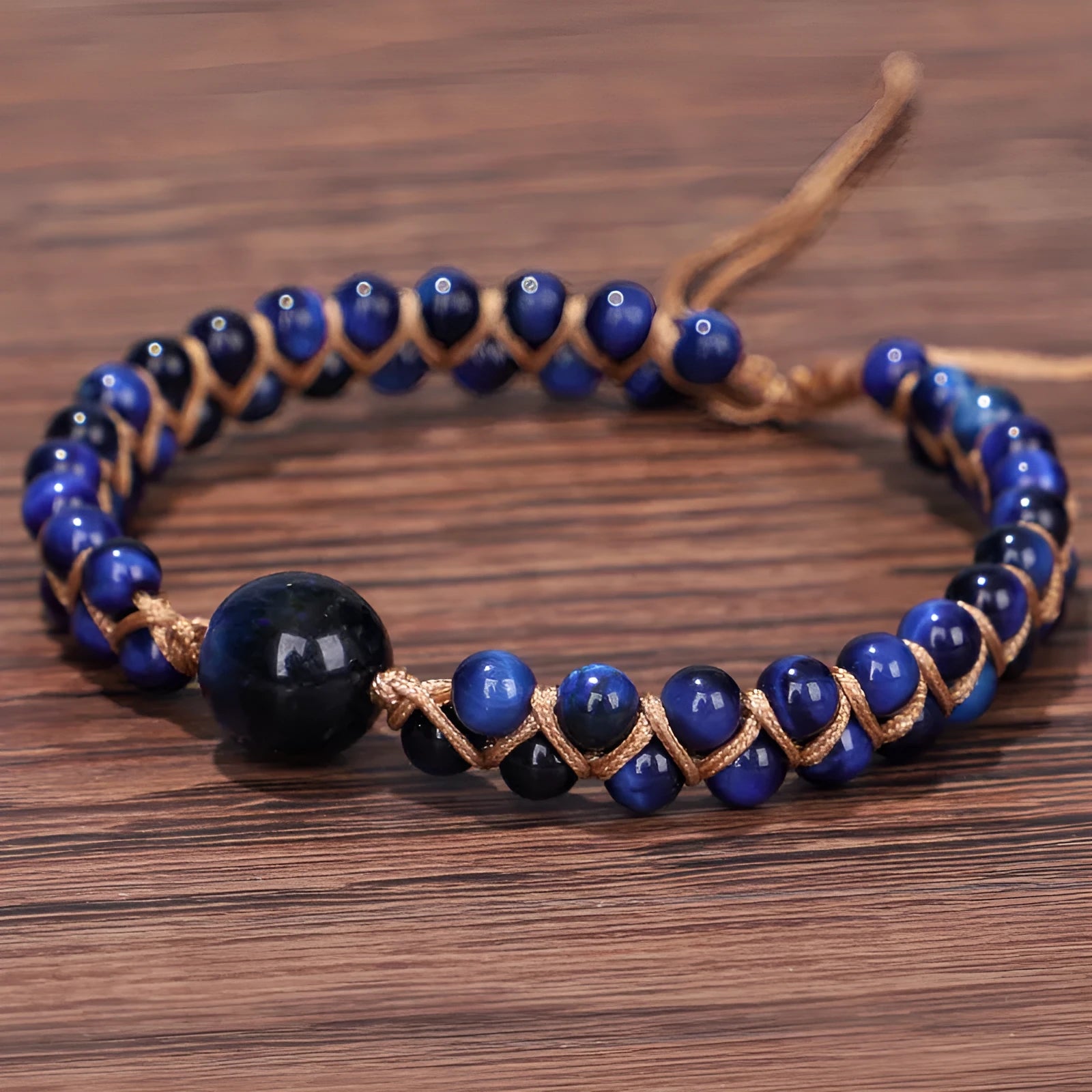 Handmade woven geometric pull bracelet in Tigereye stone showing blue and amethyst colour options