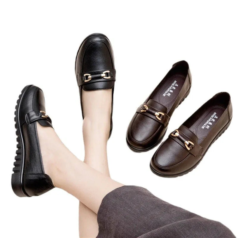 Black soft leather casual pumps with a round toe and low flat heel.