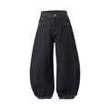 Men's original cow colour wide leg denim trousers laid flat.