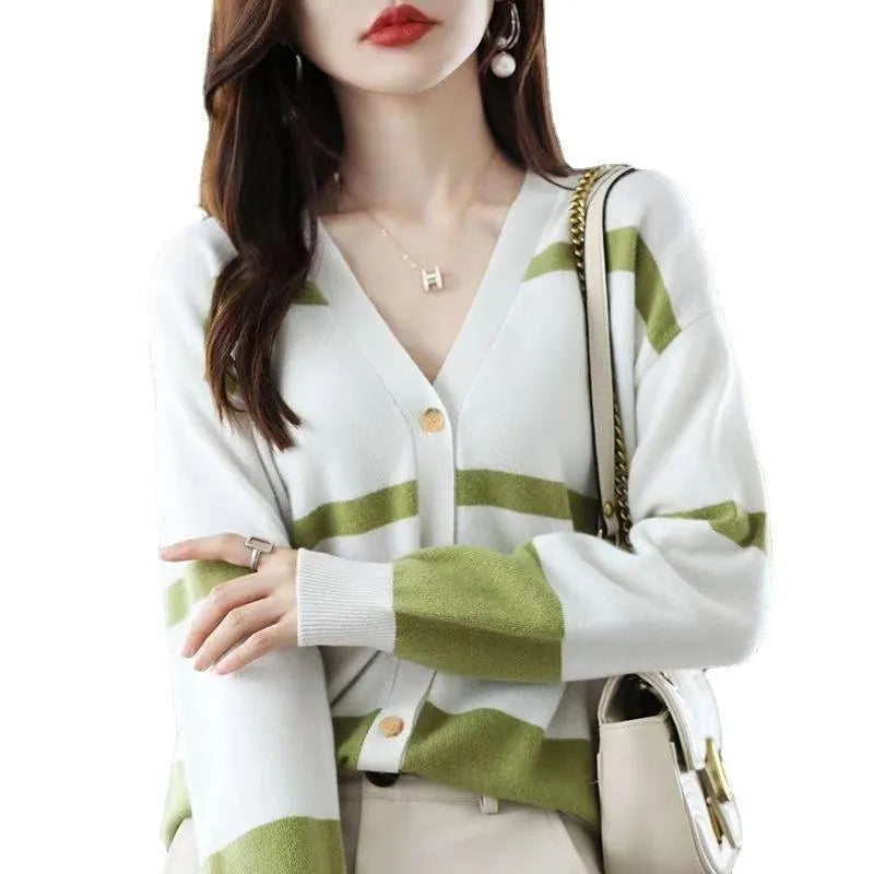 Women's slim fit V-neck cardigan with a raised 3D striped knit pattern in black and white.