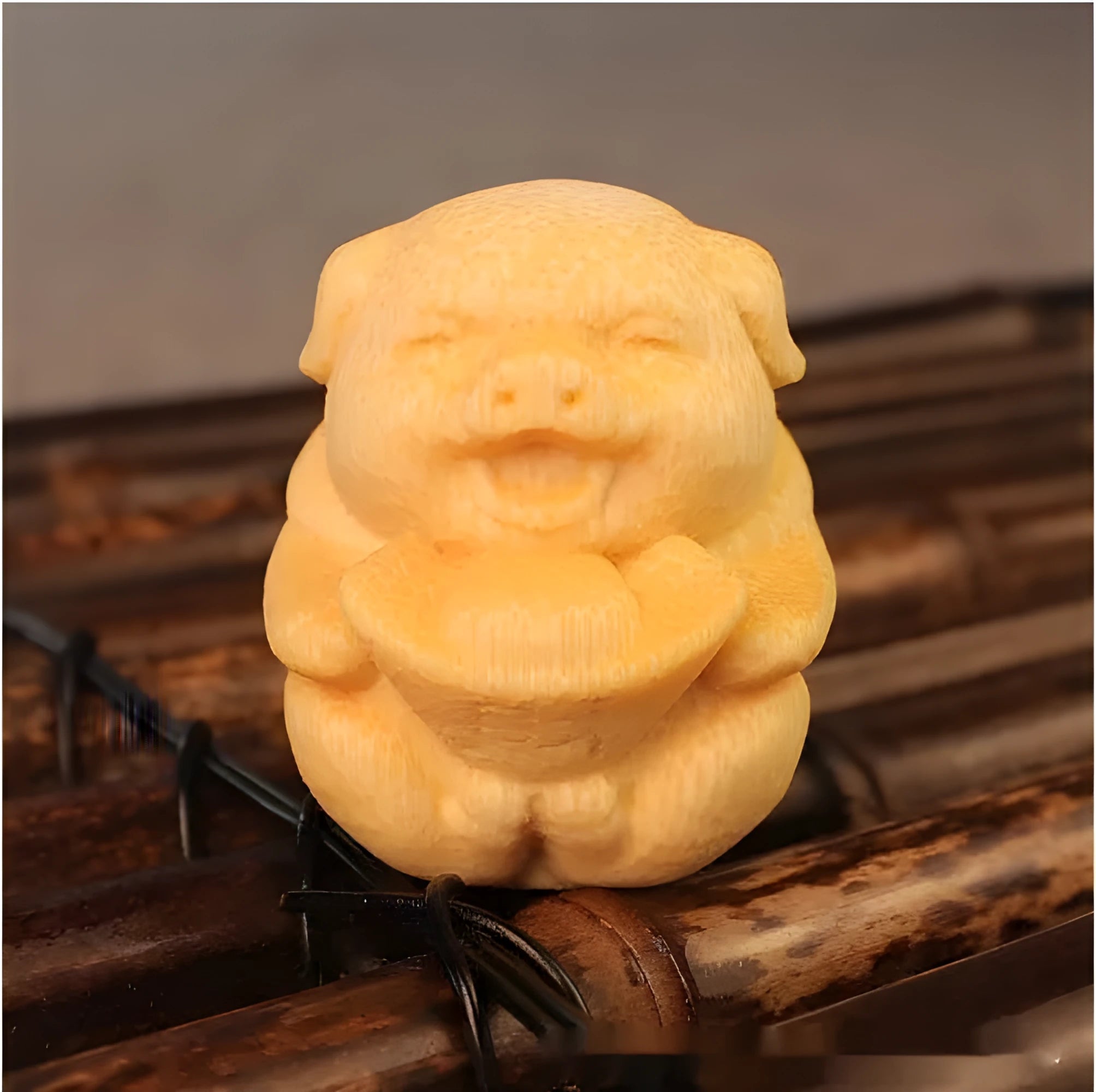 Solid bamboo carving ornament of pig ingot measuring 4cm tall by 3.5cm wide