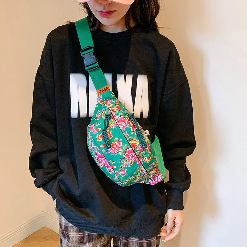 Western style women's waist bag with large flower design and contrast stitching in nylon