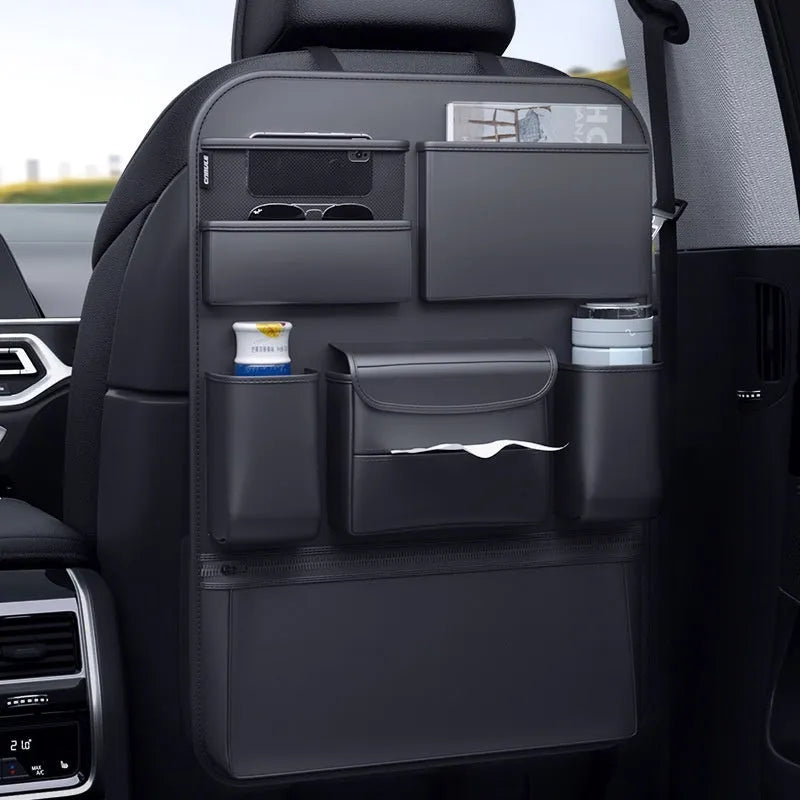 Black genuine leather car seat back hanging storage bag with a carry handle.