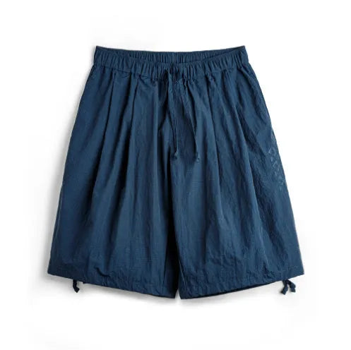 Men's embroidered loose fit nylon shorts in Prussian Blue colour with elastic waistband