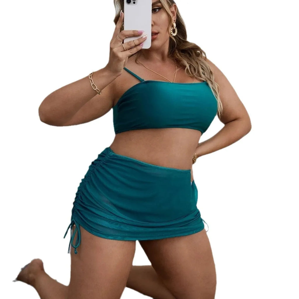 Women's solid colour mesh bikini three-piece set with top, underwear, and apron on mannequin