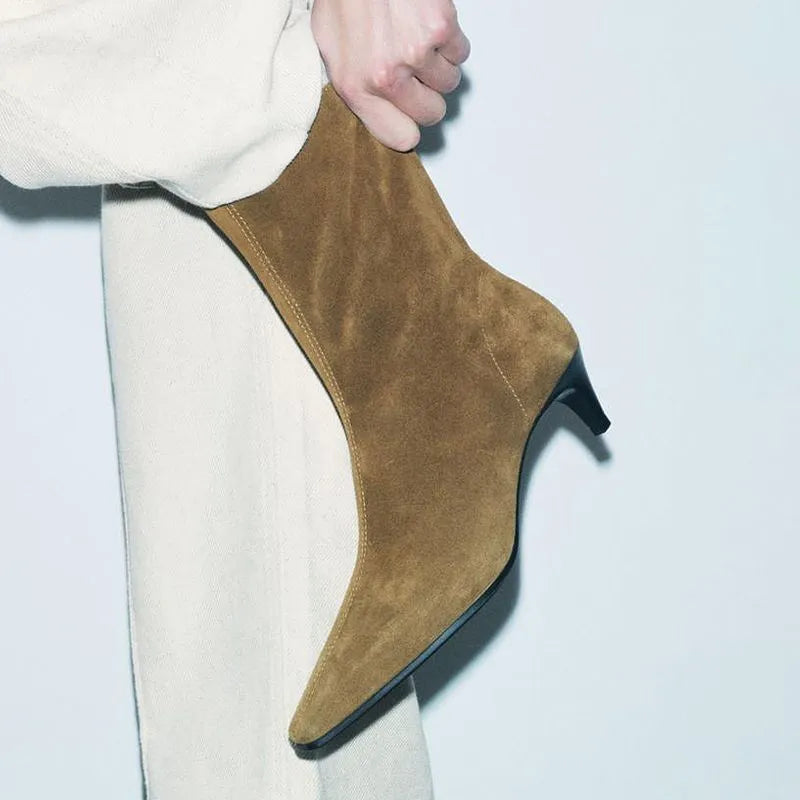 Brown square toe ankle boot with a side zip and a waterproof platform kitten heel.