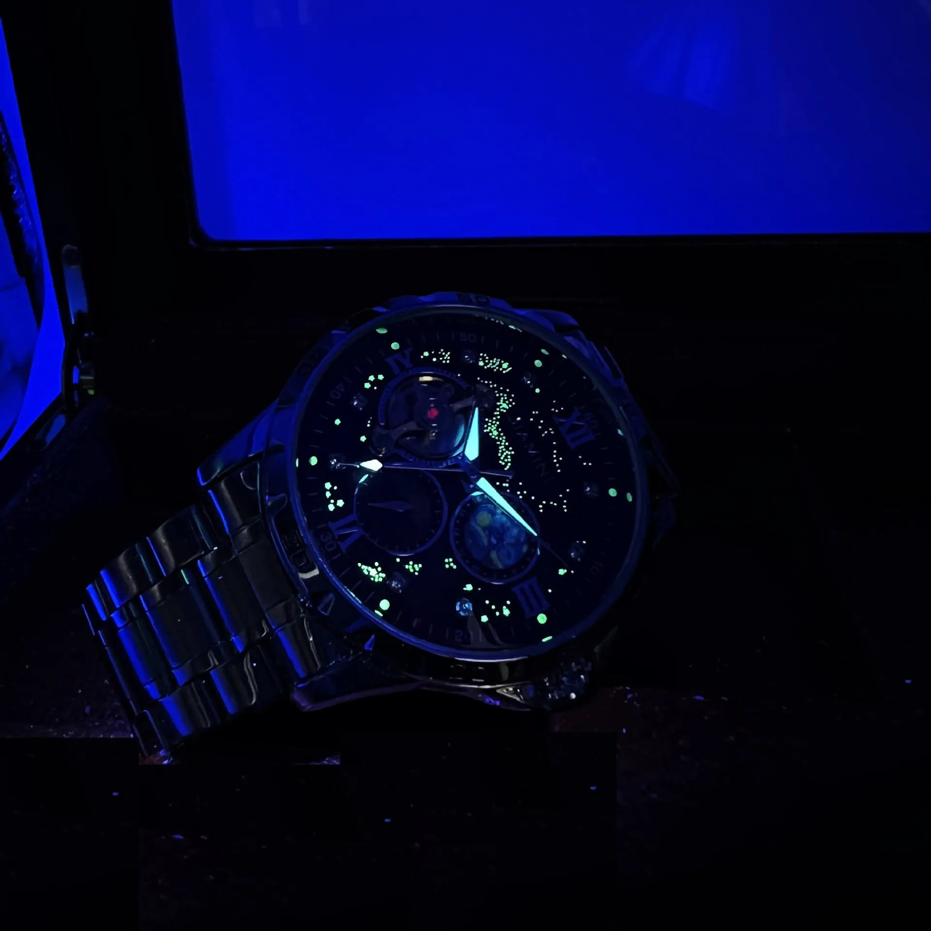 Men's automatic mechanical watch with large black dial and rose gold case.