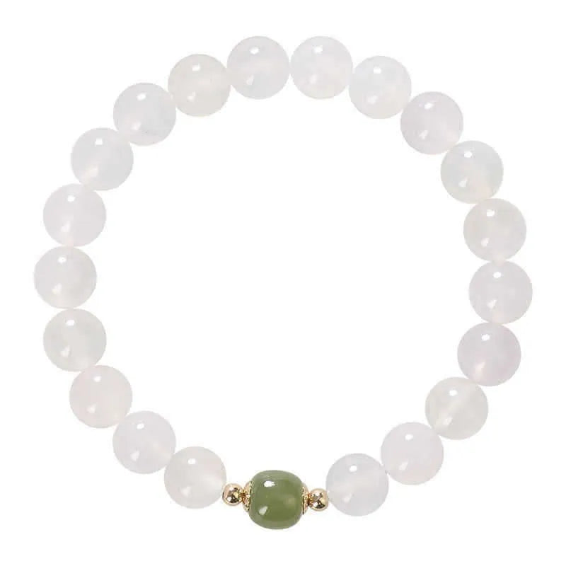 Handmade natural white agate crystal bracelet with cinnabar inlay details in 6mm and 8mm sizes