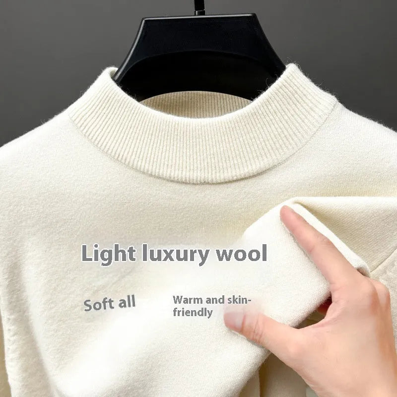 Men's fine wool half turtleneck sweater in a solid colour, showing long sleeves and regular fit.