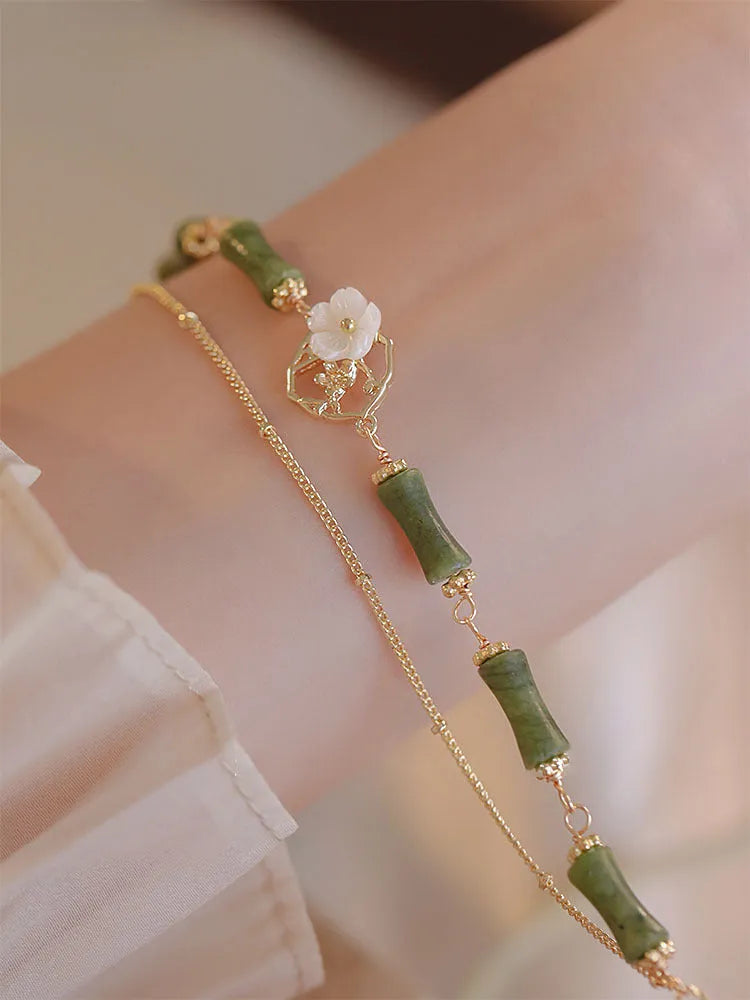 Handmade natural olivine bracelet with Chinese double layer design and olive branch motif.