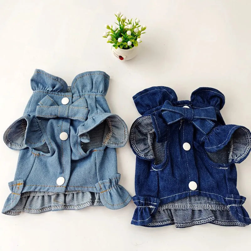 Dark blue denim dog dress with ruffles and a metal leash hook on the chest.