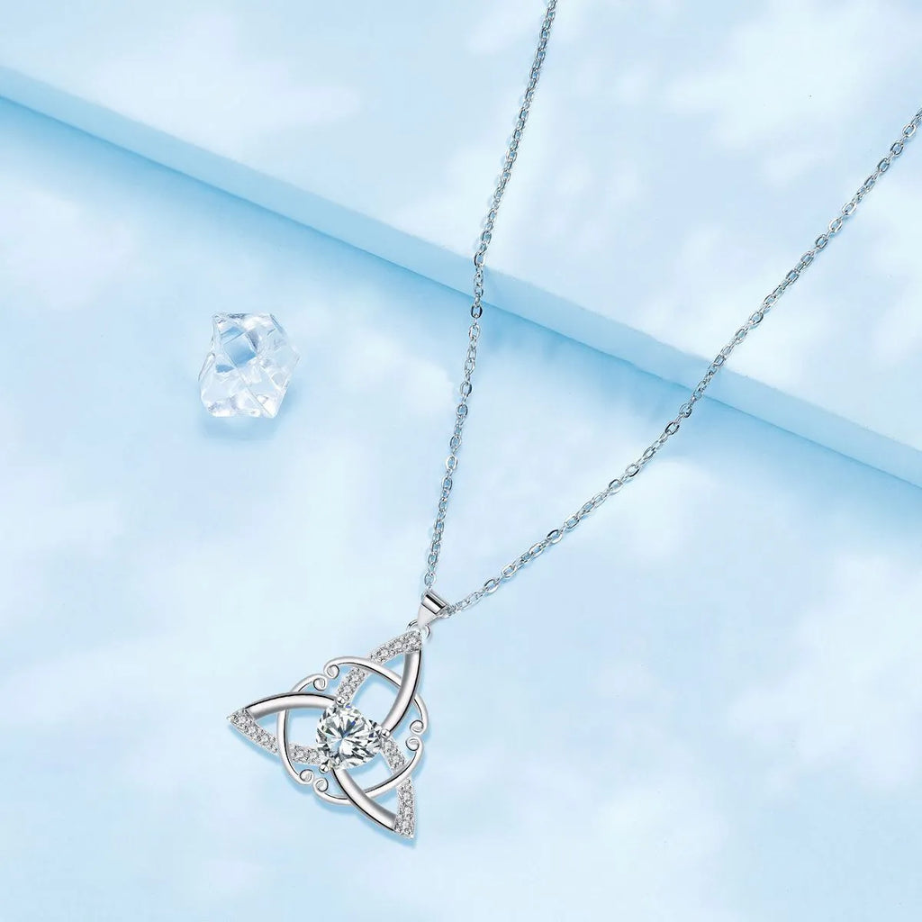 Women's Celtic knot geometric pendant necklace in copper with electroplated blue finish.