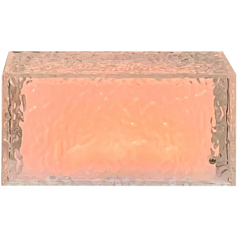 Geometric ice cube shaped acrylic night lamp with colour changing illumination on wooden surface