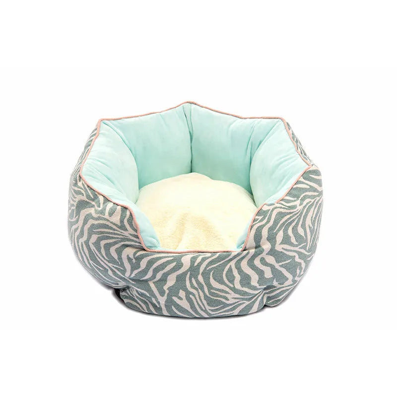 Blue octagonal pet bed with raised sides and a removable mat, for a small dog or cat.