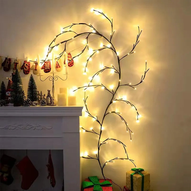 Flexible plastic willow vine LED garland light with warm white bulbs and birch bark texture.