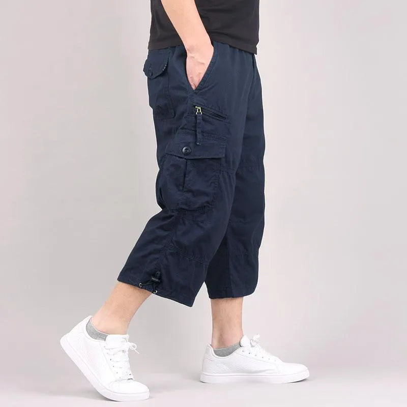 Men's cotton cropped casual pants in loose fit showing khaki colour option with sports styling