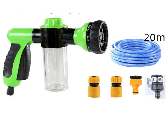 Green high-pressure foam spray gun with adjustable nozzle and attached water hose for car and garden cleaning.