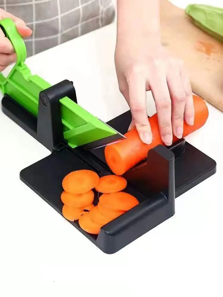 Green and red modern vegetable cutter with stainless steel blades for cutting carrots and potatoes.