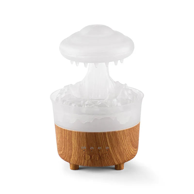 Wood grain white cloud-shaped humidifier diffuser with glowing LED lights and water droplets.