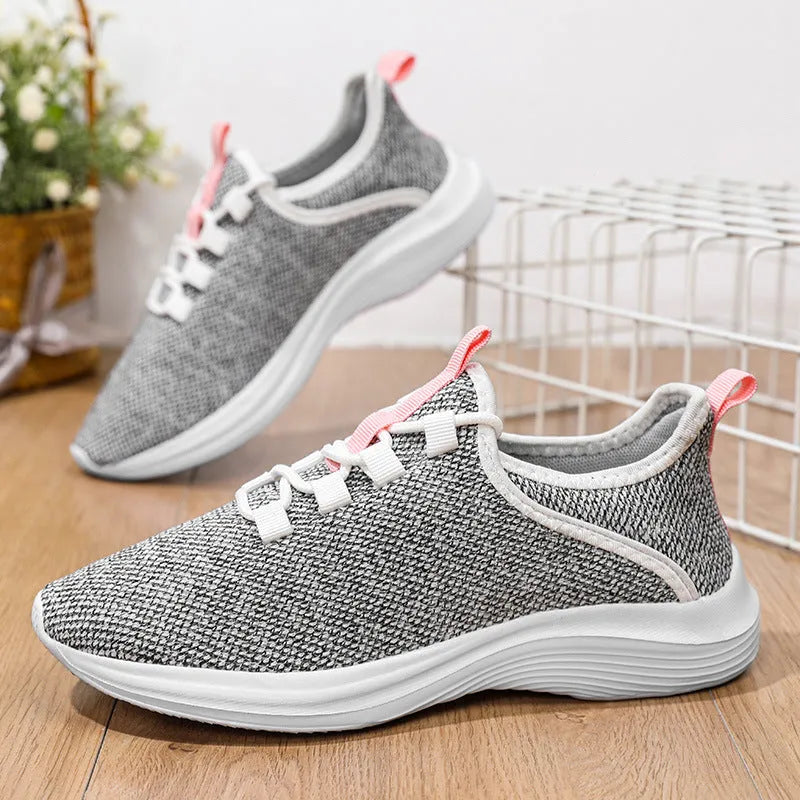 Women's casual flyknit mesh sneakers in black colour with round toe and low-top design