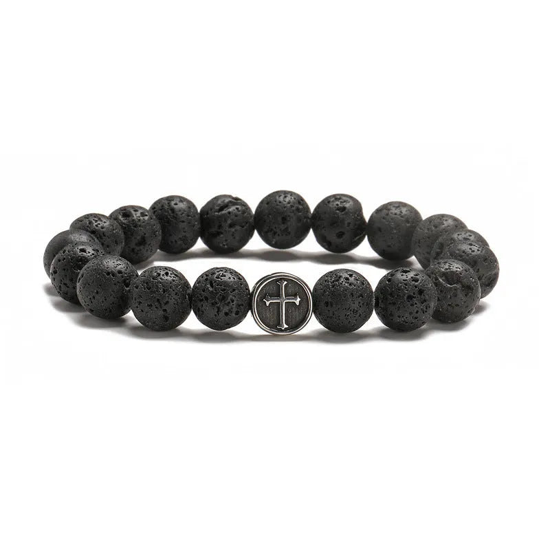Geometric agate bracelet with volcano-coloured beads and stainless steel elements on a wrist.