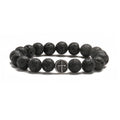 Geometric agate bracelet with volcano-coloured beads and stainless steel elements on a wrist.