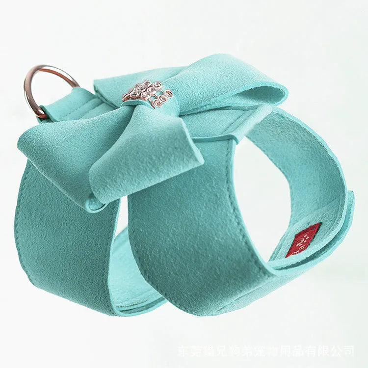 Cute pink bowknot chest strap for a small dog on a white background.