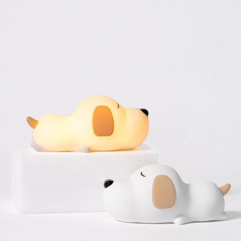 Cute silicone dog night lamp with two-color USB charging light on a wooden table