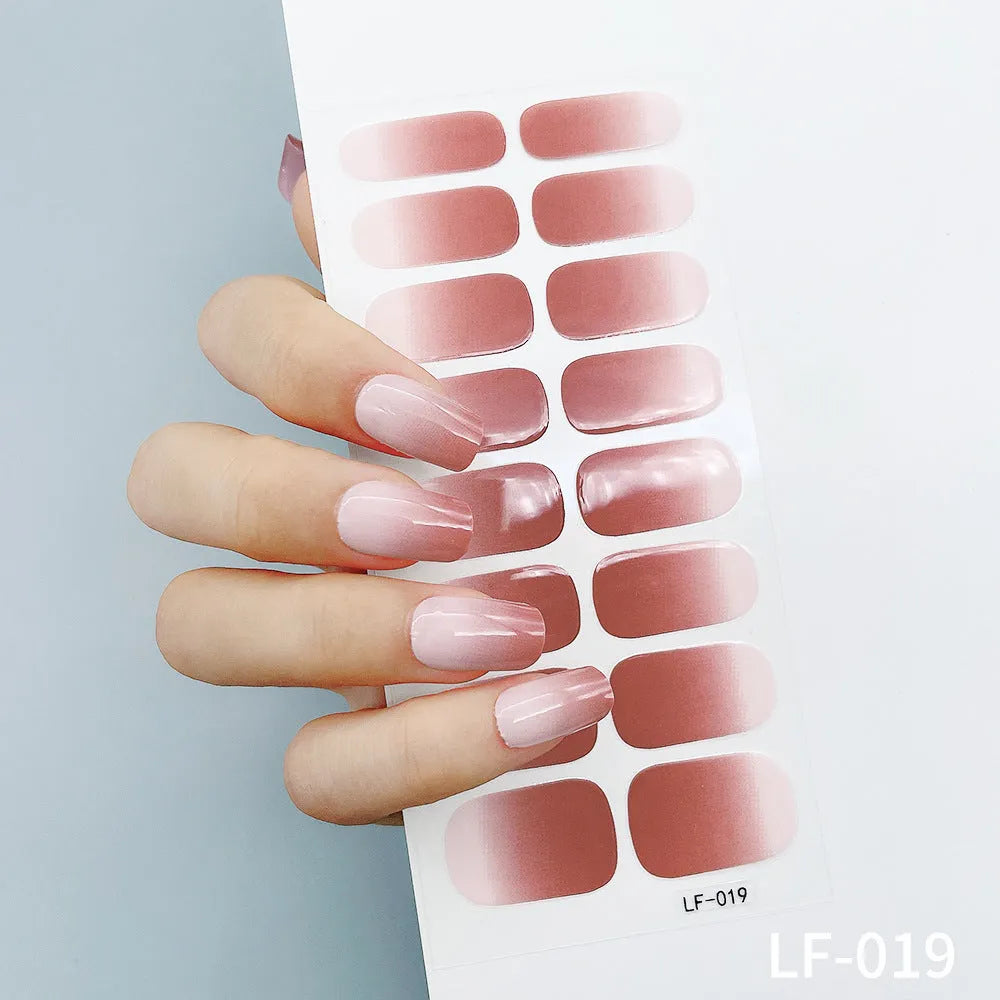 16 solid colour full nail art stickers with 22 patterns including cross, rose, butterfly designs in 12x6mm oval size