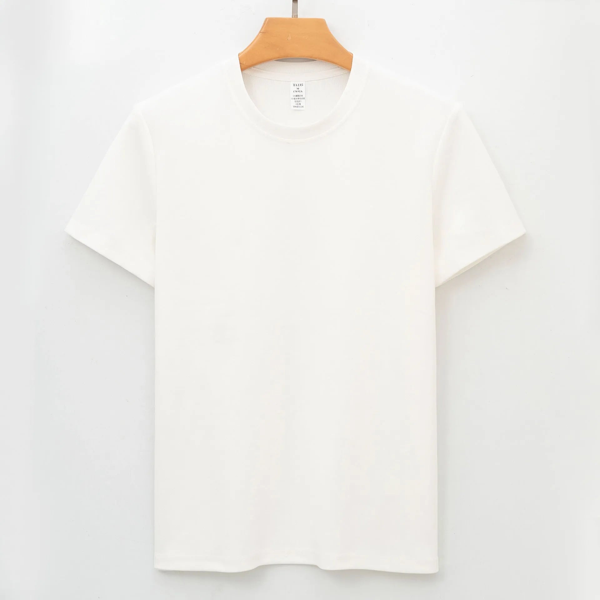 Men's solid colour antibacterial quick-dry short sleeve t-shirt on a hanger, straight cut style.