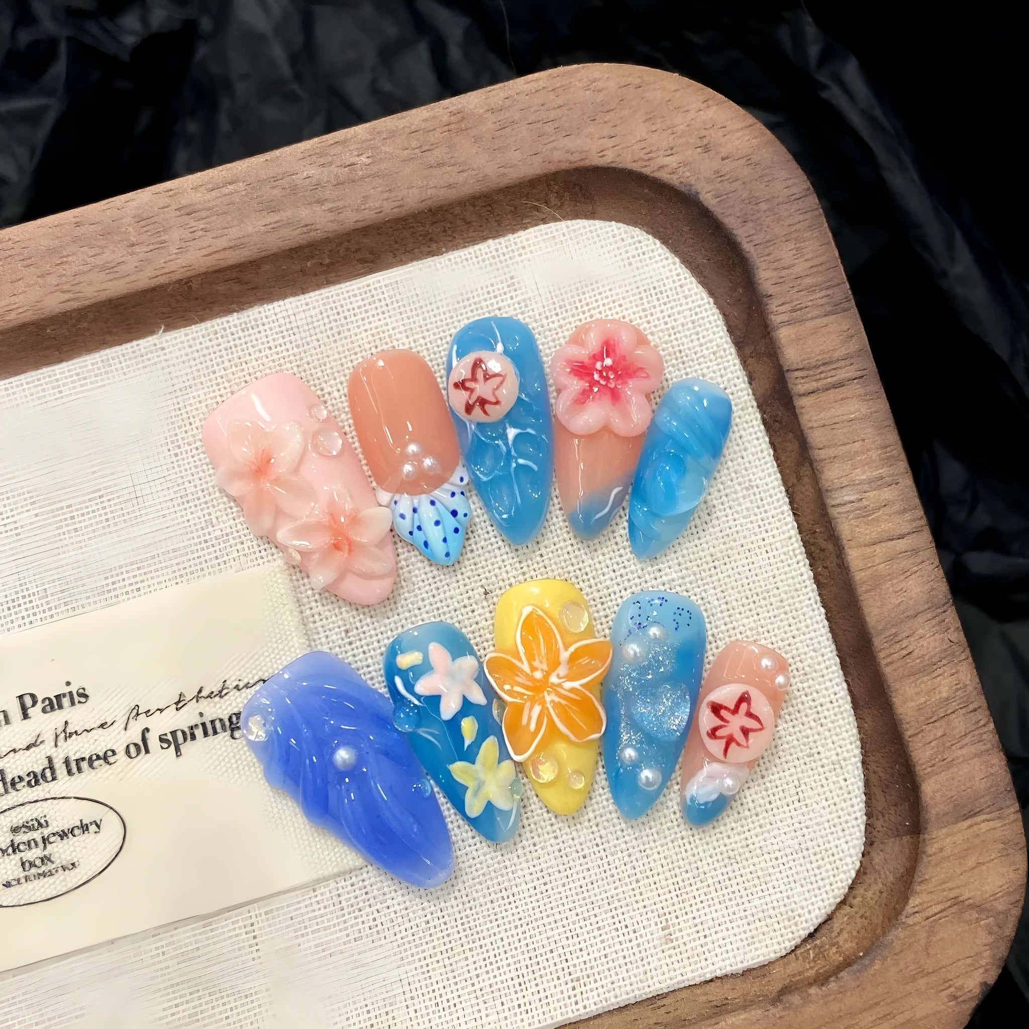 Three-dimensional carved jellyfish design plastic armour set in almond nail colour with marine styling