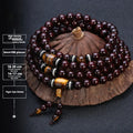 Men's rosewood prayer bead bracelet with 108 beads shown in a turquoise style variant.