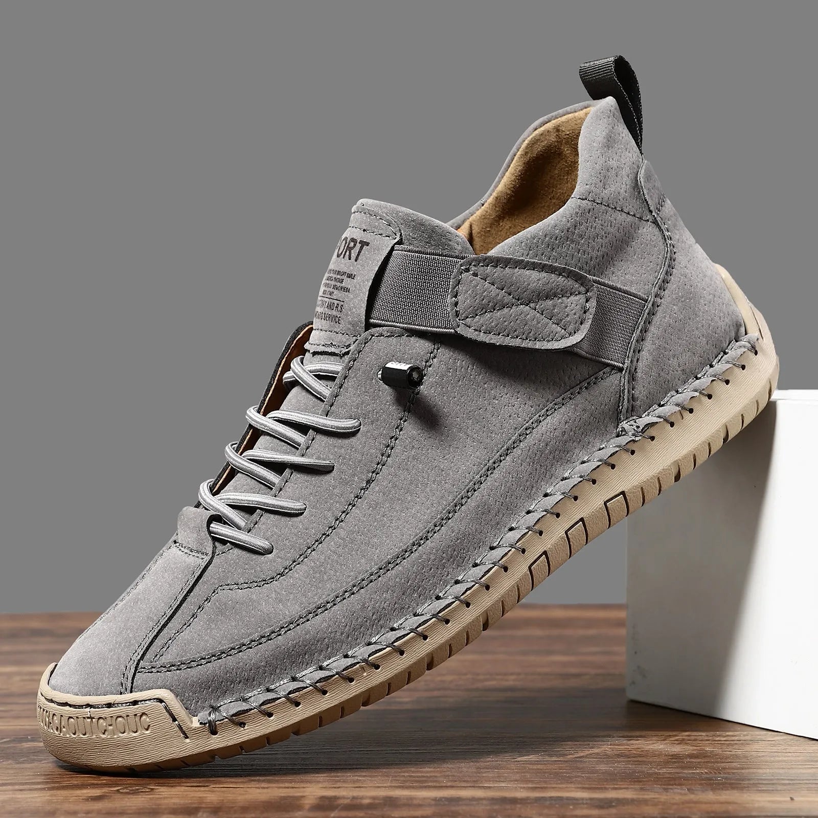 Men's mid-top Martin boots with microfiber upper, leather lining, and rubber sole in solid colour options for winter outdoor wear.