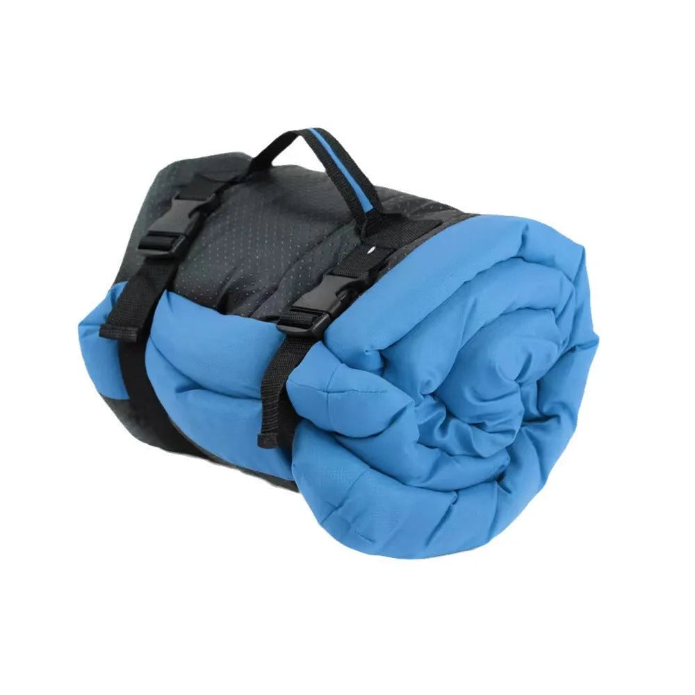 Blue foldable waterproof dog bed shown unfolded and folded, with nylon buckles and dotted anti-slip bottom.