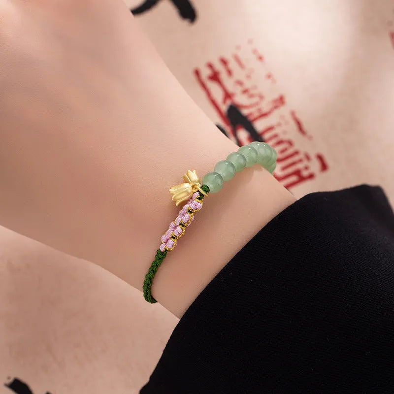 Hand woven red rope bracelet with flower decorations in national style women's design